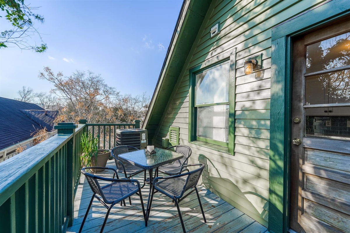 Located right off of the kitchen, enjoy the lovely  view. Feel free to enjoy breakfast al fresco! Being on the top floor, feels like you are sitting in a treehouse! 