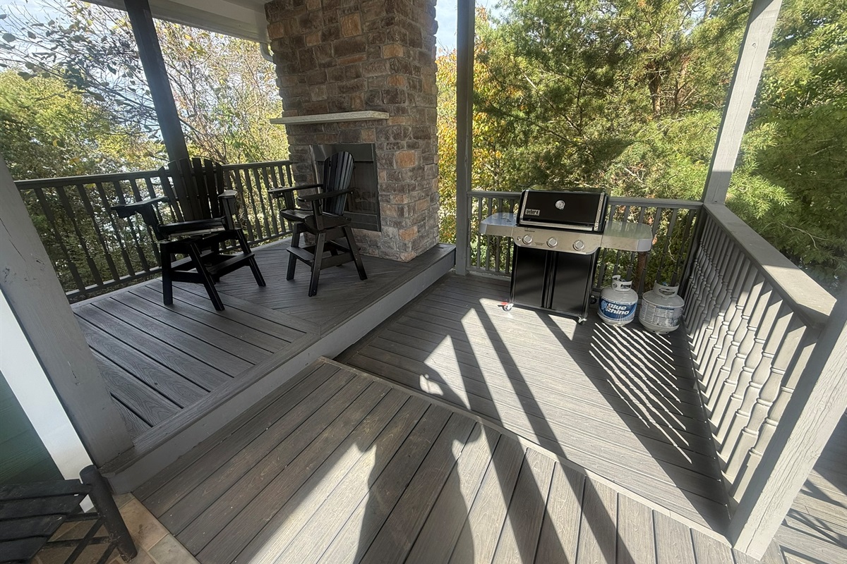 Propane Grill and deck area next to front porch and garage