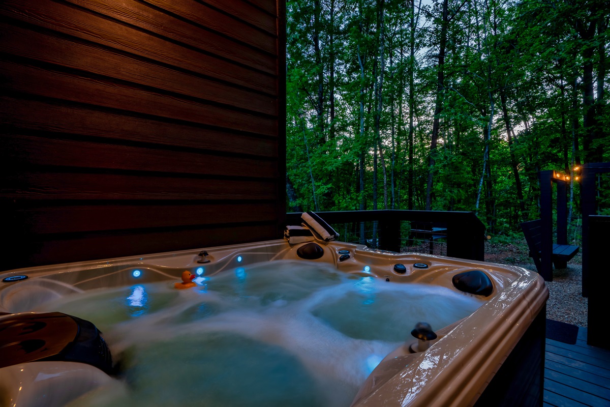 Soak in the smoky mountain air at the cabin in the Hot tub 
