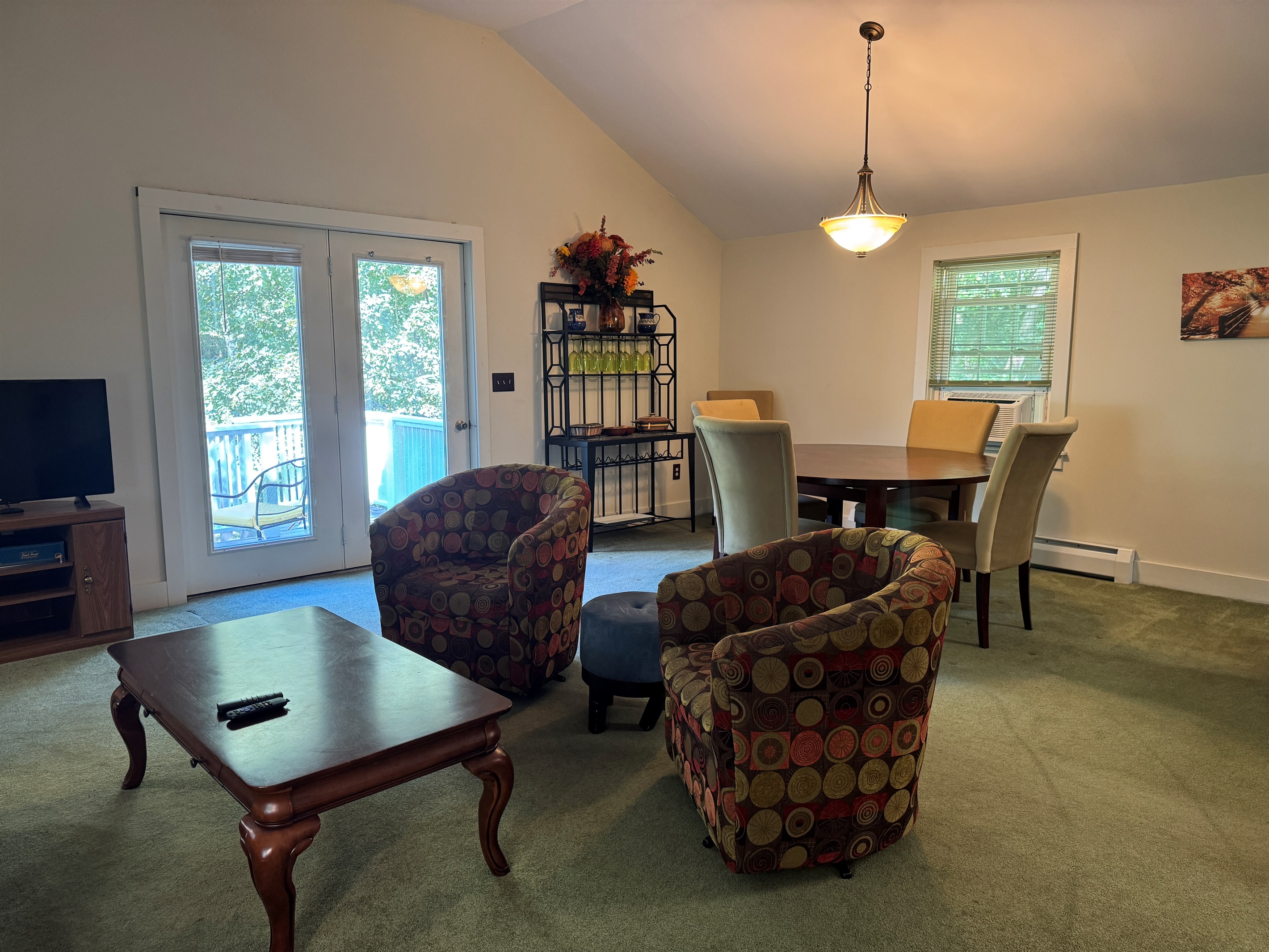 Dandelion apartment living room looking into the dining and kitchen area.