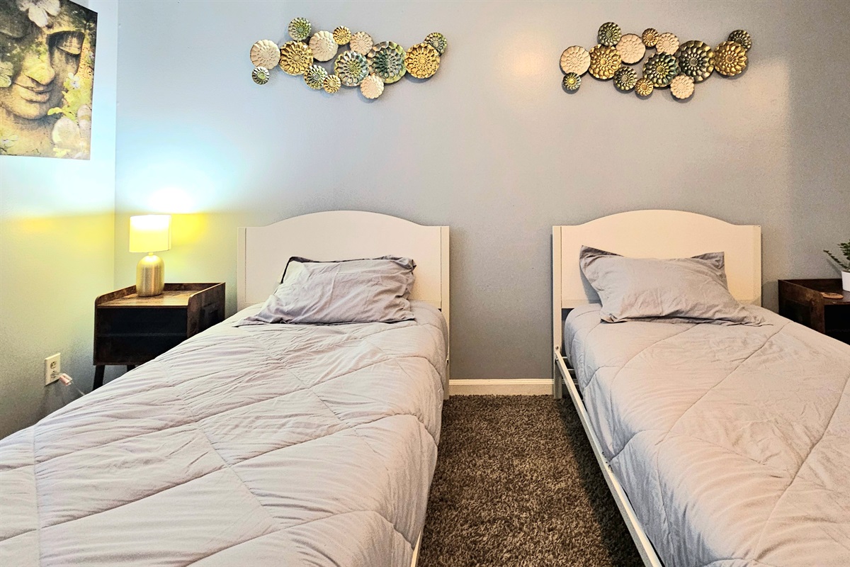 Offering versatility and design, this spacious guest room bring flexibility with two identical twin side beds, matching night stands and plenty of storage. Unique decor and natural light make this room a family friendly option.