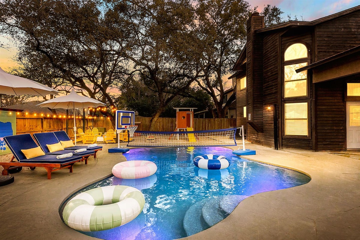 Sunset swim vibes   
Unwind poolside under string lights, take a dip, shoot hoops, or spike it over the net—your ultimate backyard escape awaits!