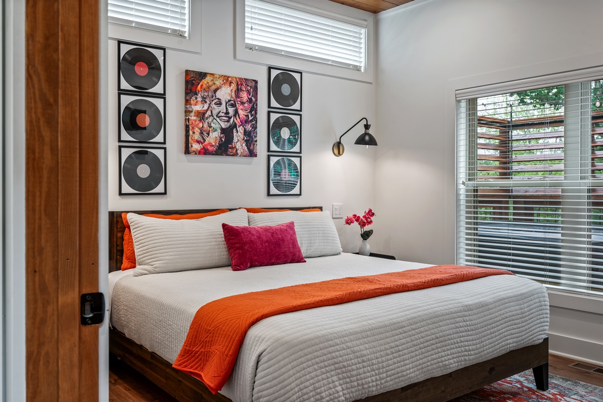 Relax in this main floor King Bedroom, convenient with the bathroom right outside the door and steps from the kitchen.
