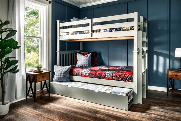 Wake up and enjoy that sunshine along with that fresh and crisp mountain air. This is the secondary bedroom in the main floor. Twin size bunk bed with a trundle - Sleeps 3.