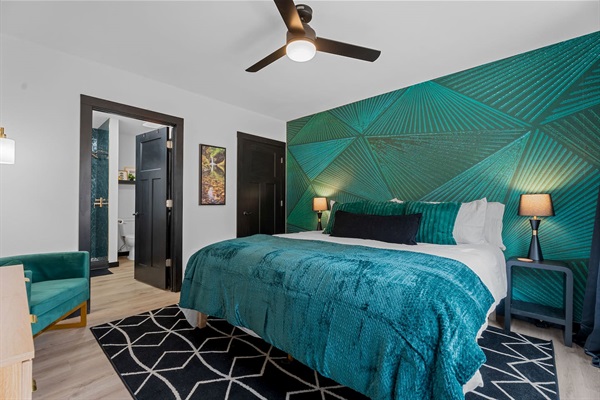 Bedroom Retreat: Vibrant emerald accents and modern decor create a stylish, restful escape!