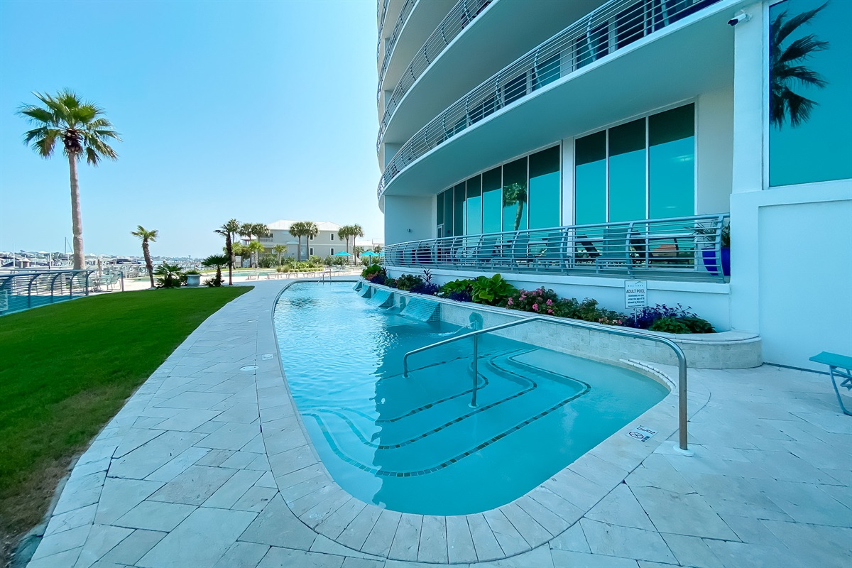 Experience undisturbed bliss. This inviting adult-only pool at Bella Luna provides a sophisticated and serene environment for residents to enjoy.