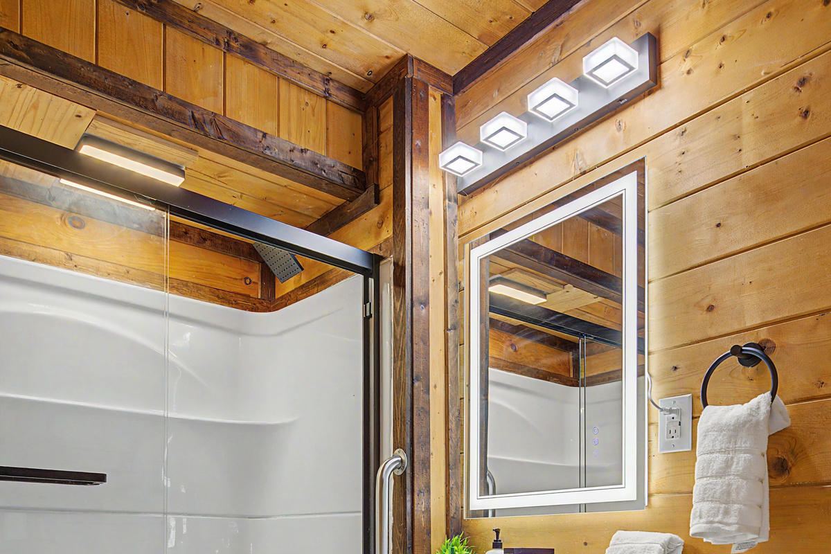 Bathroom Retreat: Sleek fixtures and warm wood create a refreshing space to unwind after adventures!