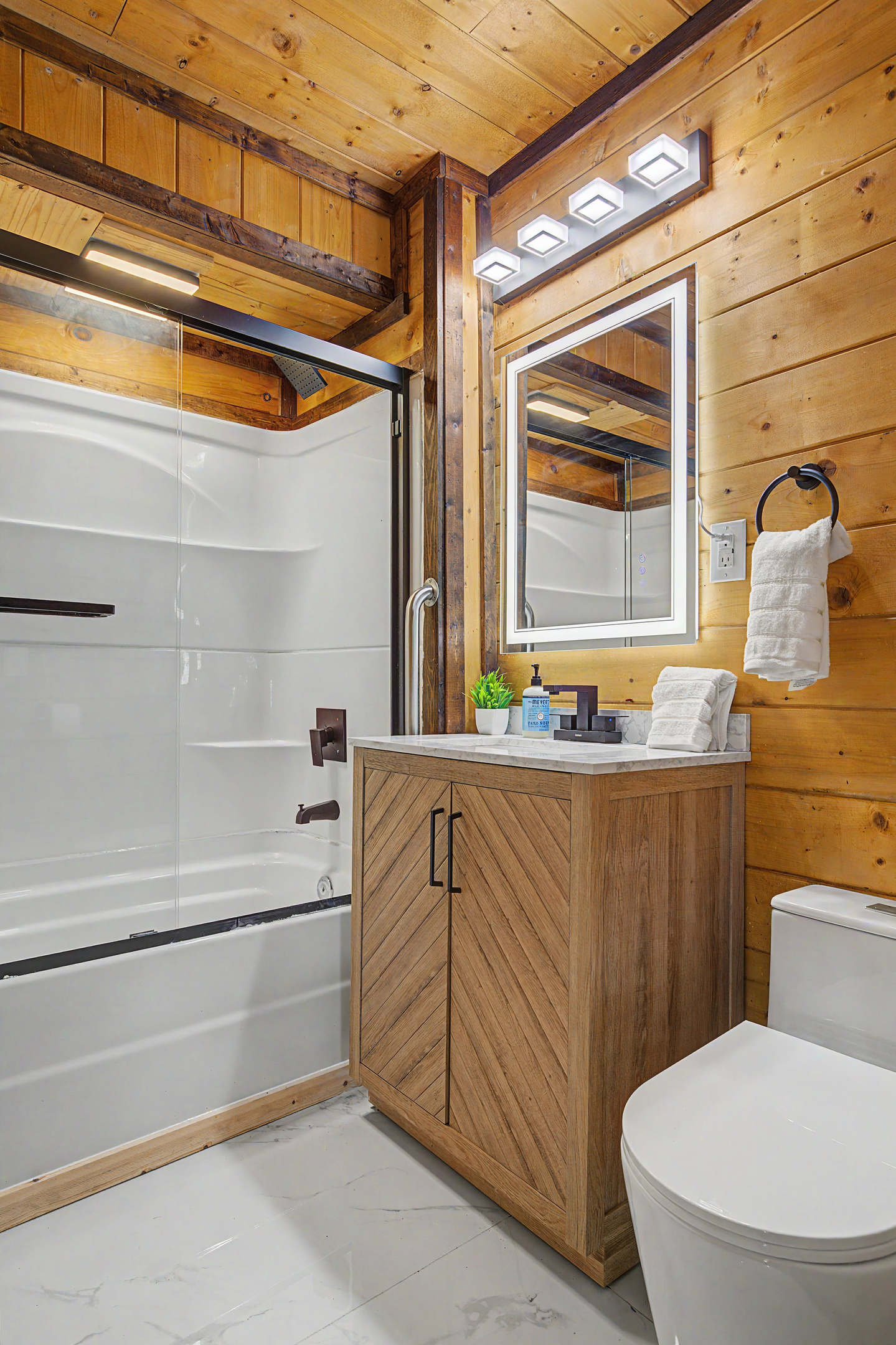 Bathroom Retreat: Sleek fixtures and warm wood create a refreshing space to unwind after adventures!