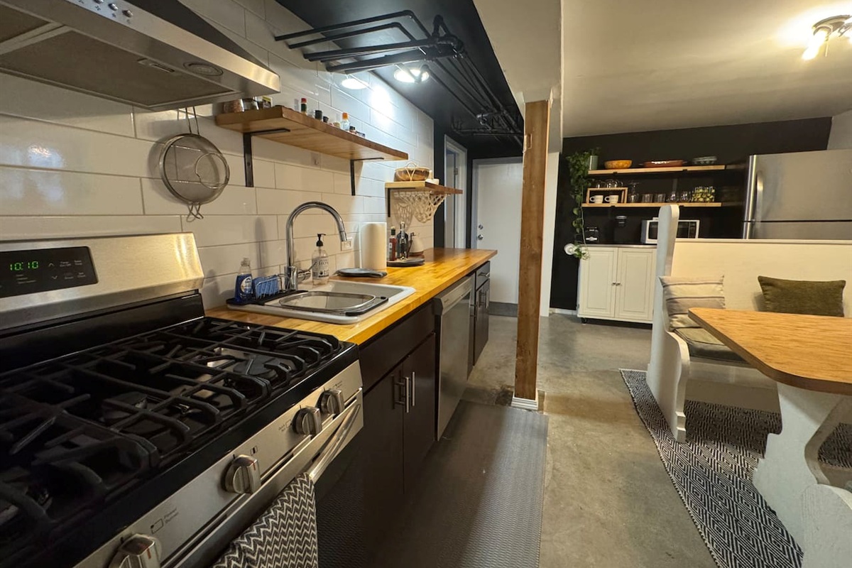 Lower-level kitchen fully equipped for cooking and entertaining— one of two kitchens  in this spacious 3-bedroom, 2-bath home. Ideal for family and groups.