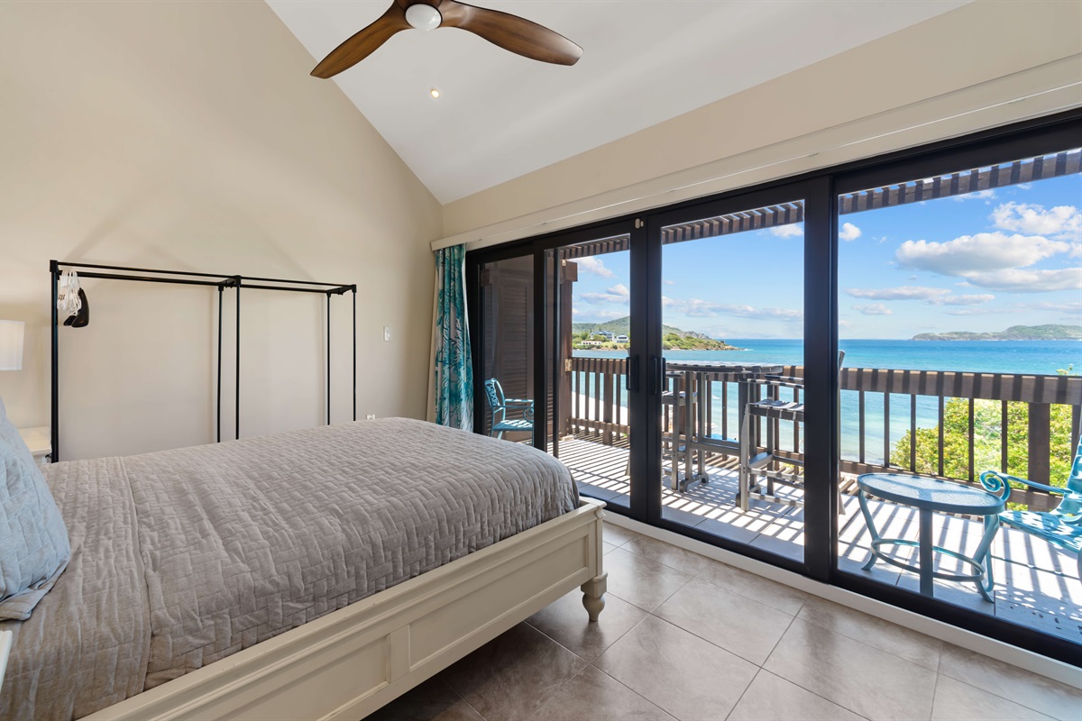 The primary bedroom boasts a queen bed, ceiling fan and can you see that view!?!  Imagine waking up to that each morning.