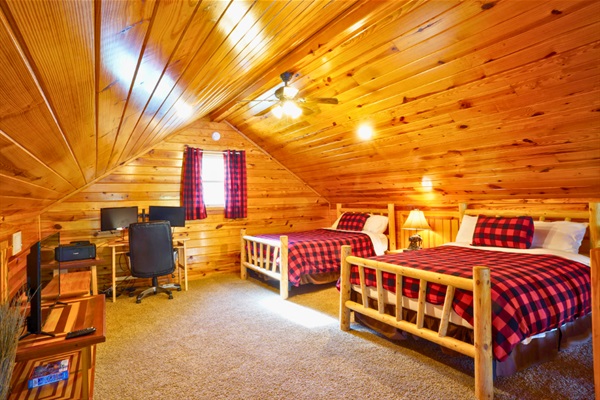 Loft sleeping area with 2 full beds + full pull-out sofa — perfect for kids or extra guests.