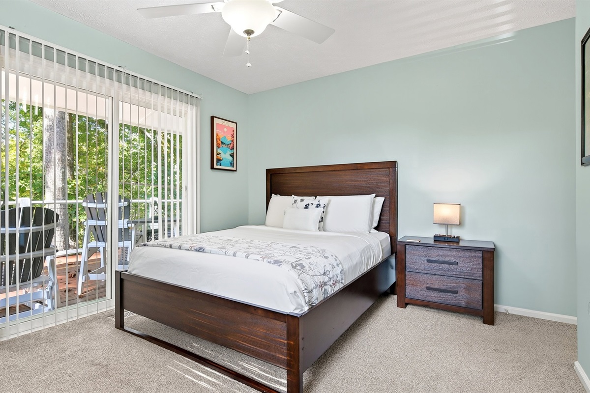 Bedroom 2 on the main level has private access to the deck.