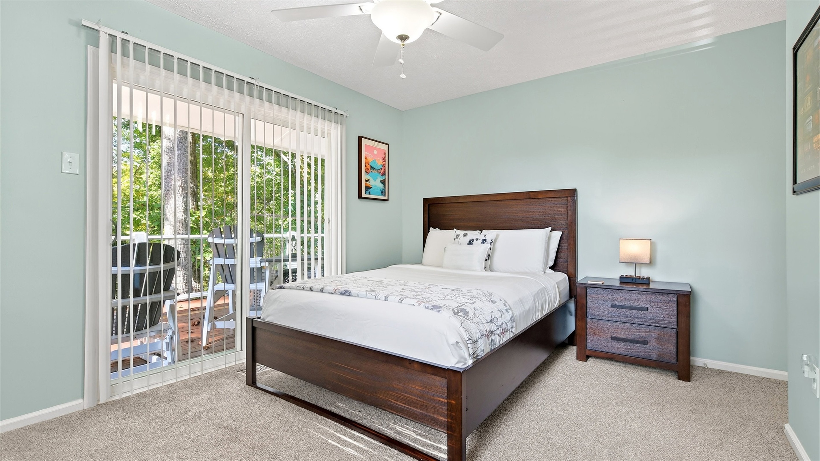 Bedroom 2 on the main level has private access to the deck.