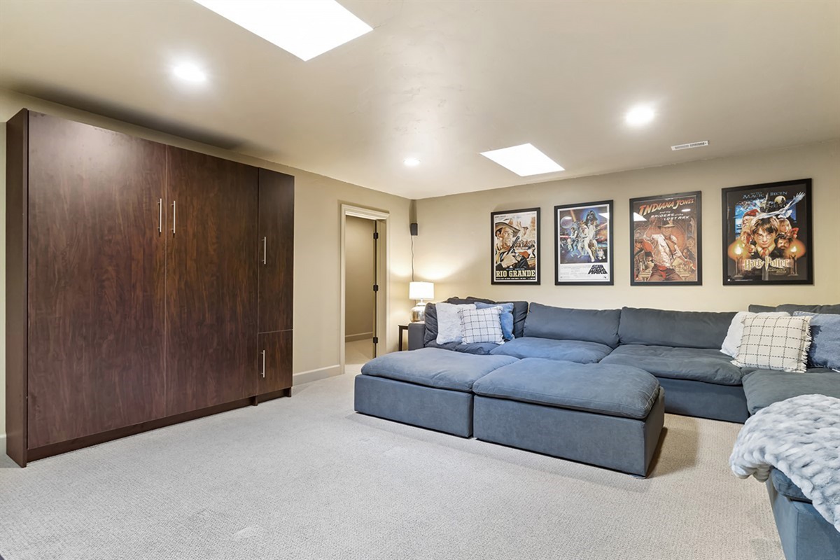 A dedicated TV room with oversized seating—perfect for movie nights or catching the game.