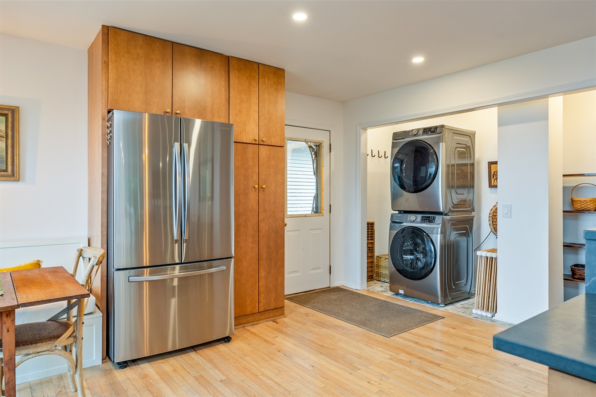 Functional meets fashionable in this spacious layout with stainless steel appliances, pantry storage, and easy access to a well-equipped laundry zone