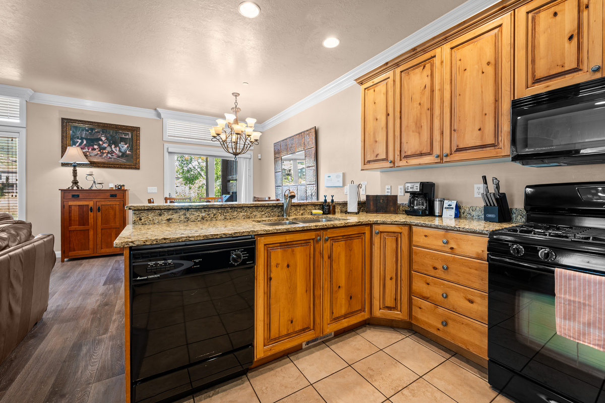 Open kitchen with generous counter space overlooking the dining and living areas.