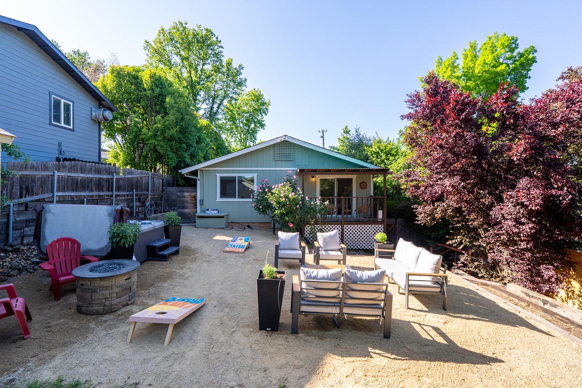 Cozy seating and outdoor fun in a peaceful garden setting.