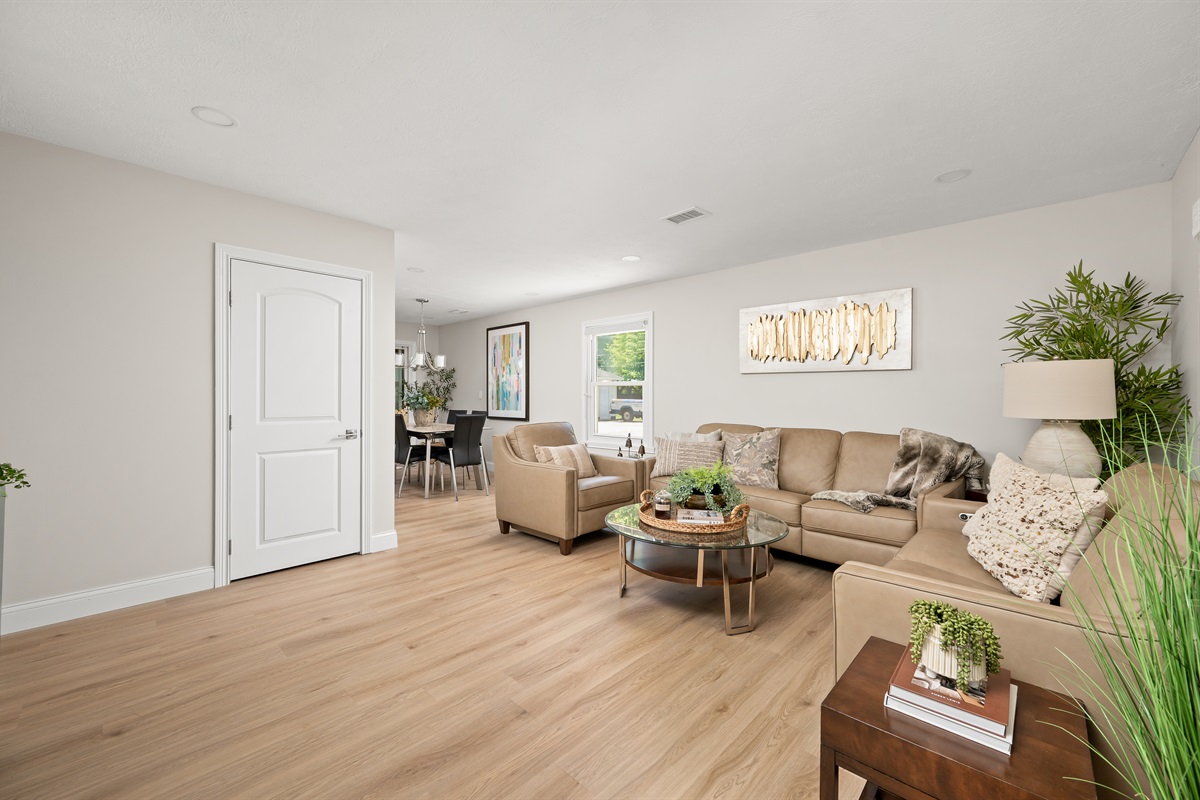 Open concept living and dining area creates the perfect space for gathering, entertaining, and spending quality time together.