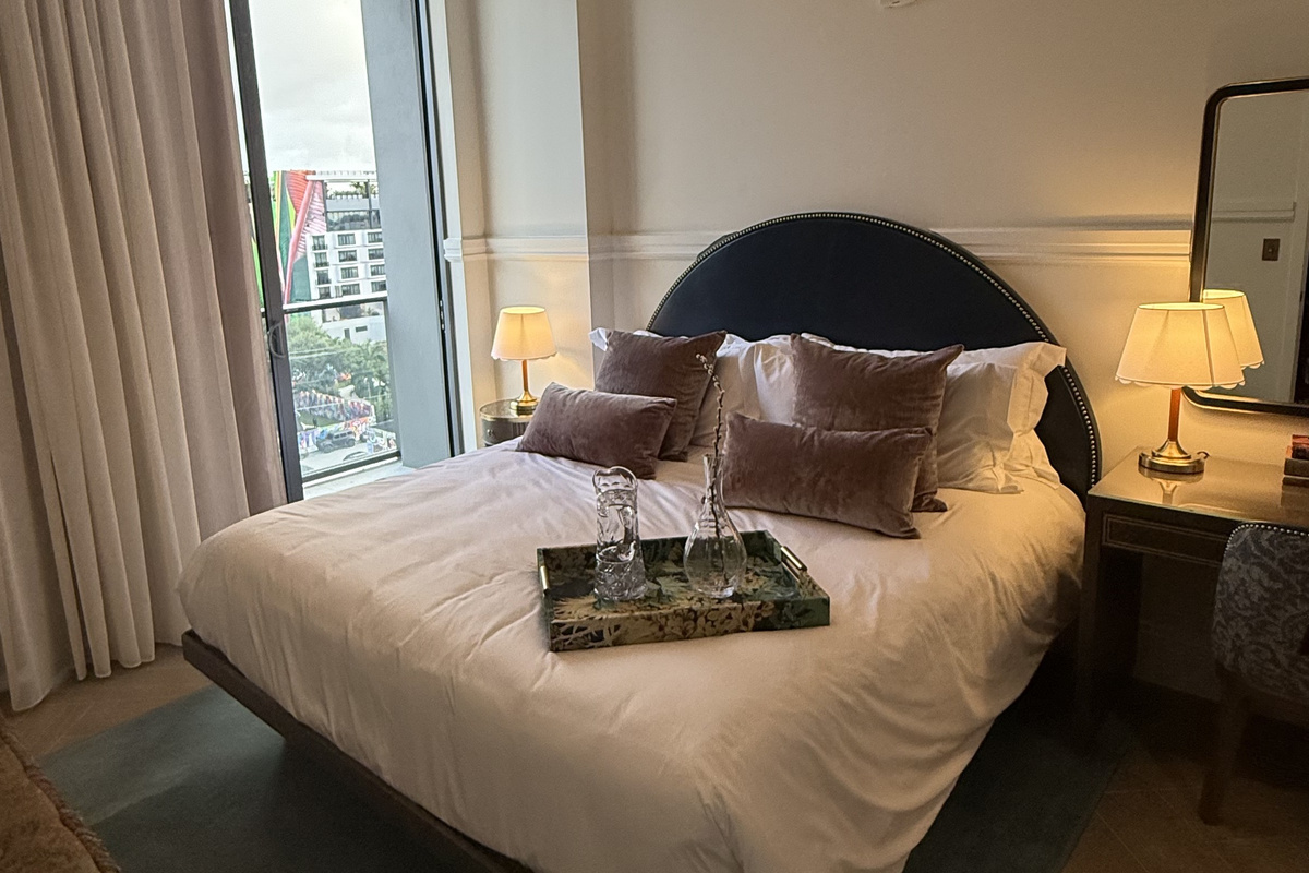 The king bed is dressed in layered, hotel-quality linens for that first unforgettable nights sleep.