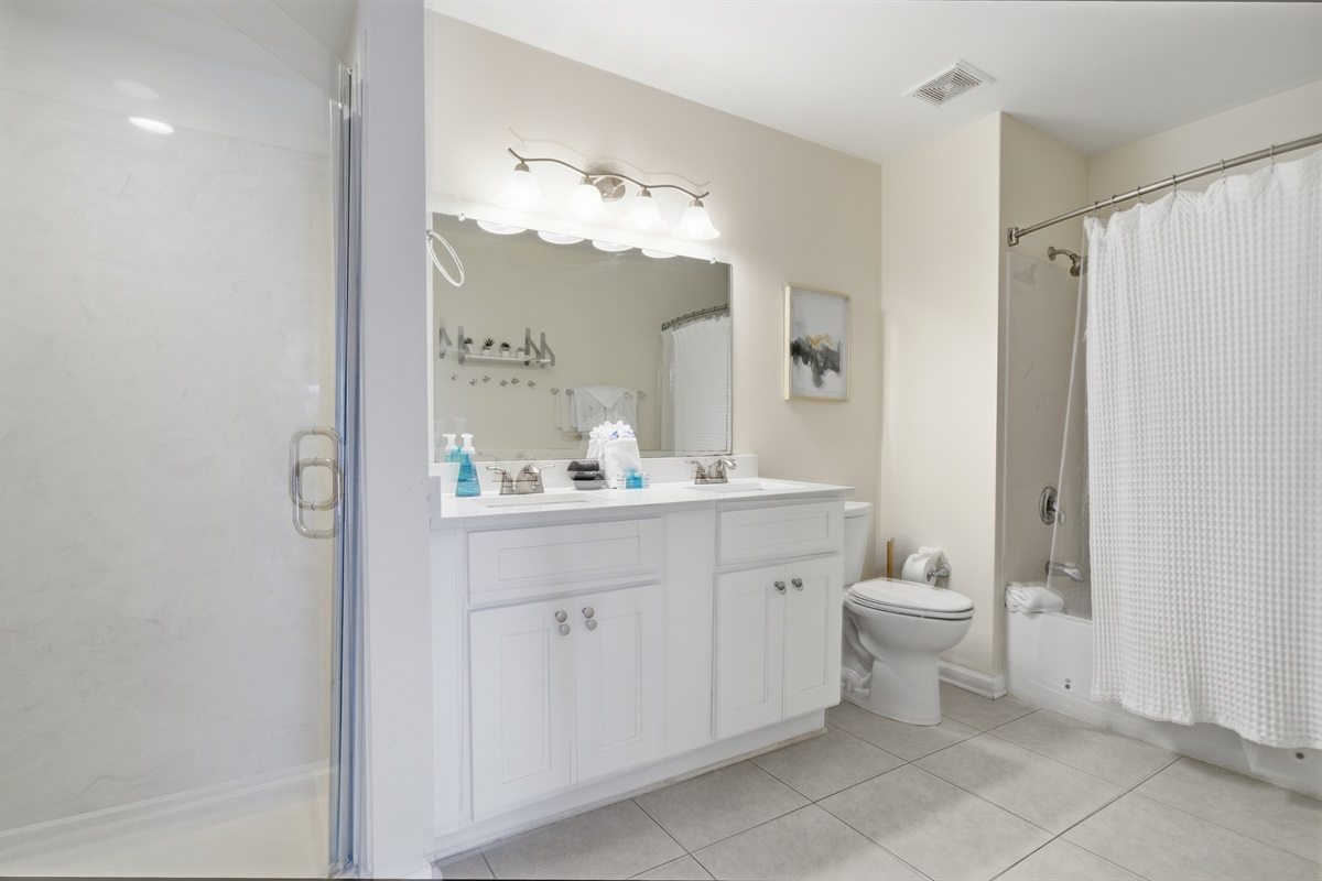The Master bathroom has not only two vanities but two showers! One stand-up and the other is a shower/tub combo allowing two people to get ready at the same time!