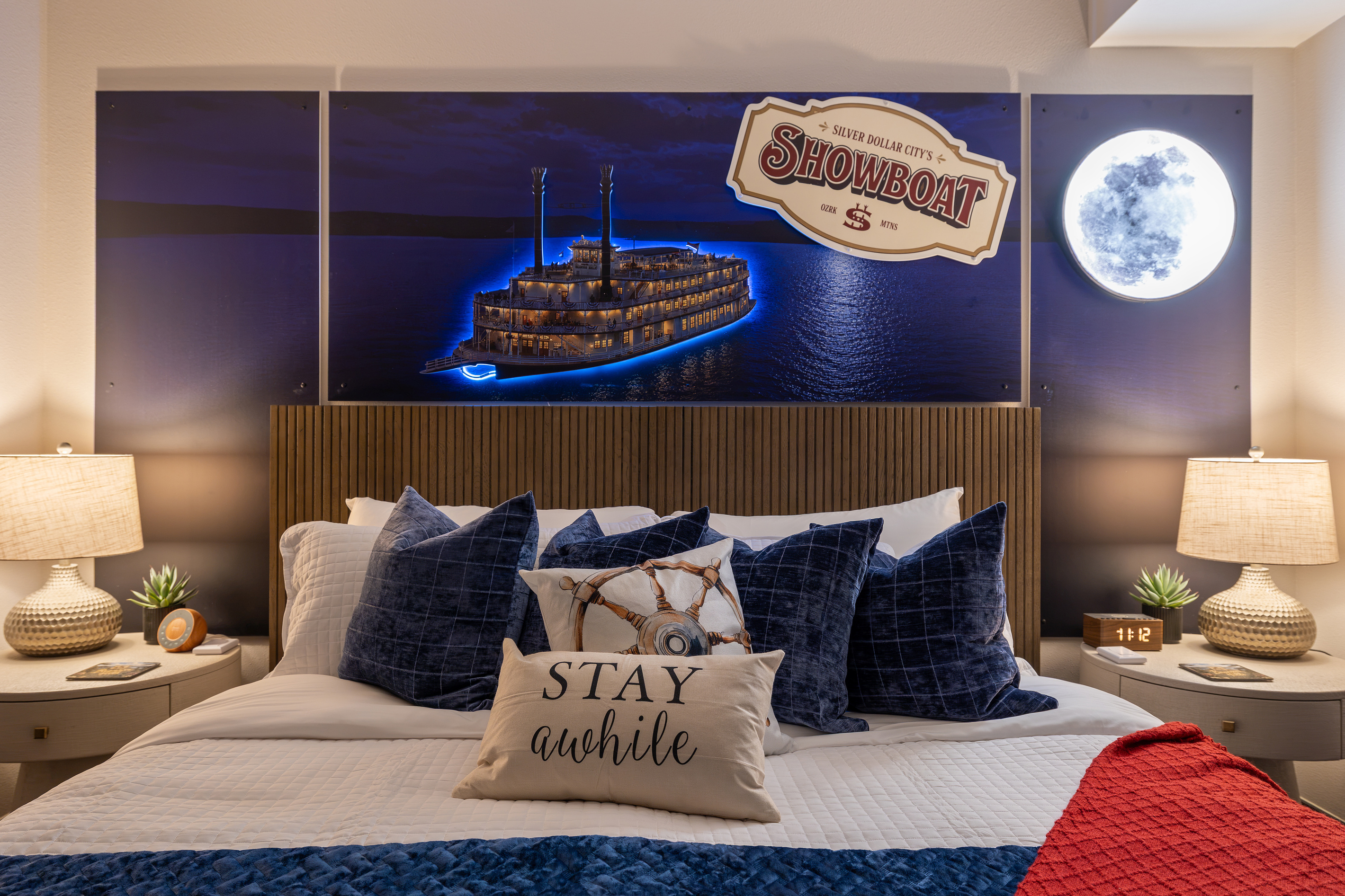Warm lamplight and a paddle-wheeler drifting across the mural.