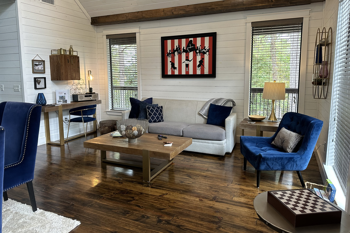A view of the dining and living room areas at First Kiss - cozy, comfortable and exceptionally luxurious for your romantic couples getaway in this high end suite!