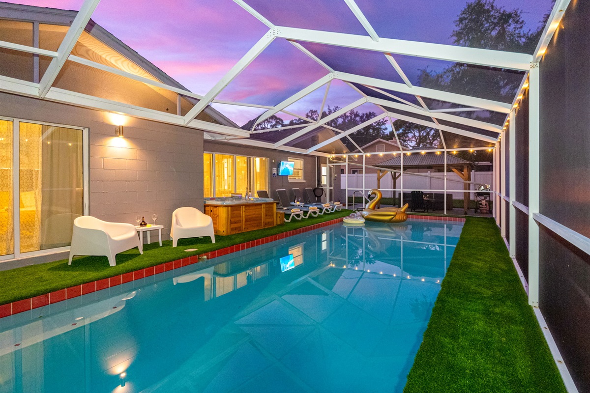 Protected from the elements and buzzing insects, the screened enclosure ensures you can enjoy this space comfortably anytime.