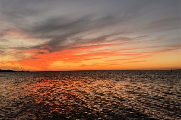 Sunsets over the bay are just a short walk down the street.