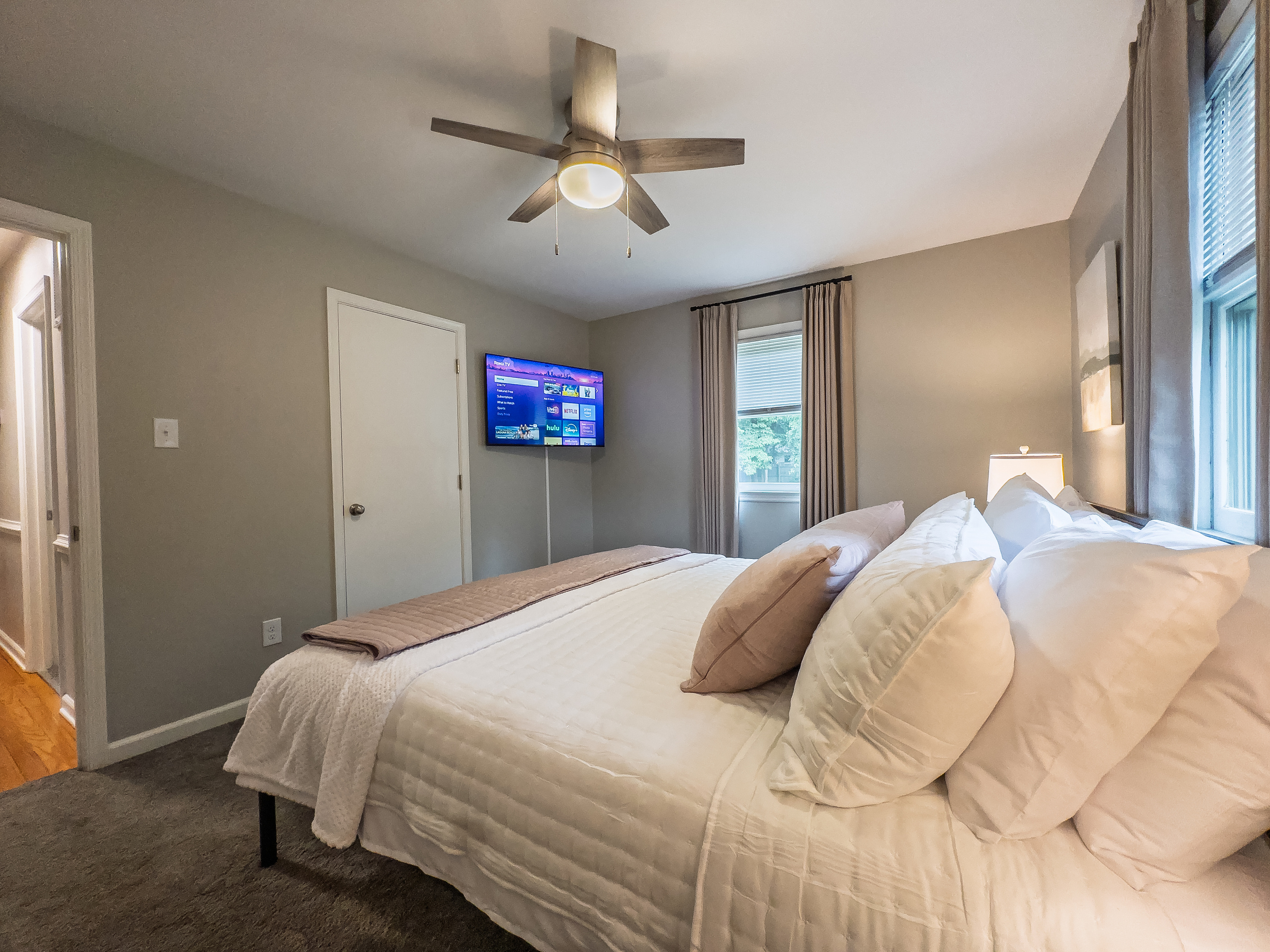 King bed, 55" Smart TV, ceiling fan, two led light nightstands with multiple charging ports, two multi light function lamps, blackout curtains, dual closets.