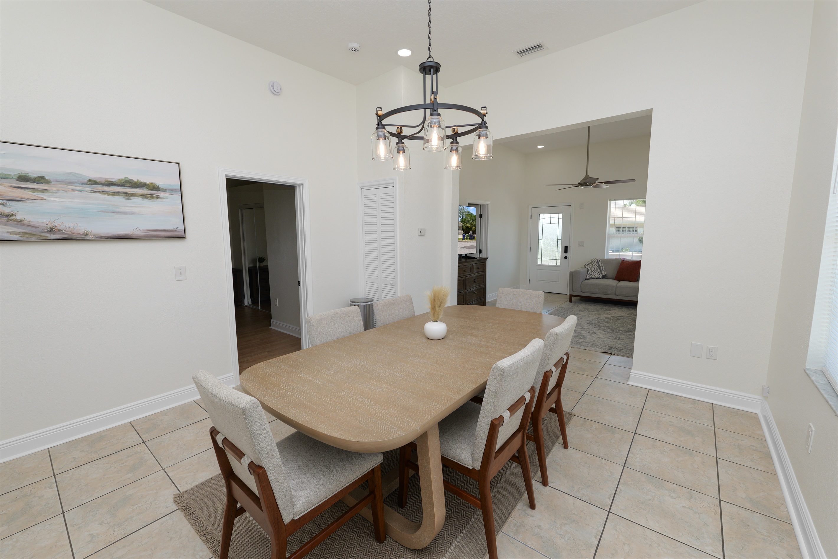 Ideal for families and groups, this dining setup seats 8 comfortably and sits at the heart of the home.