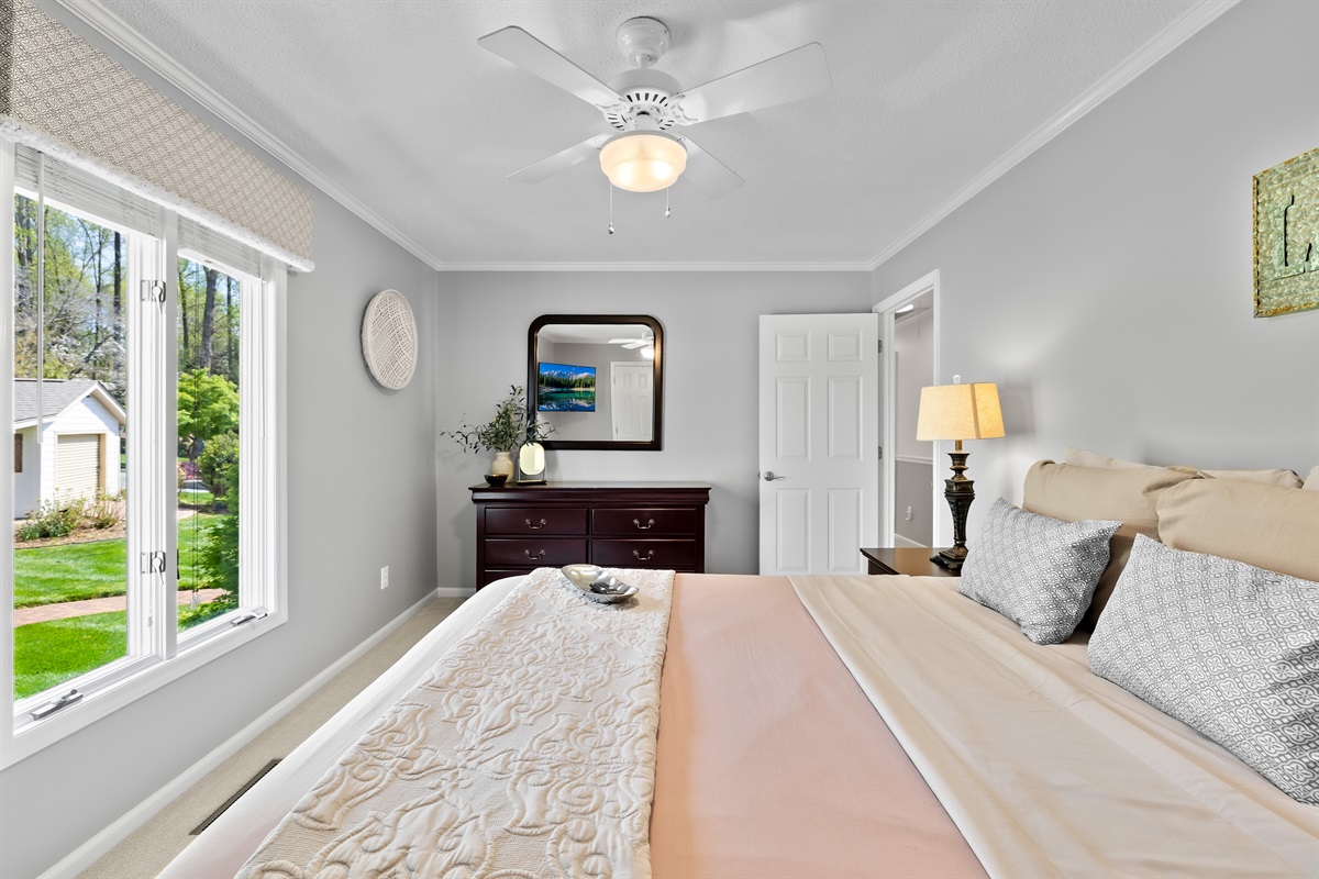 Bright and welcoming bedroom with comfortable accommodations.