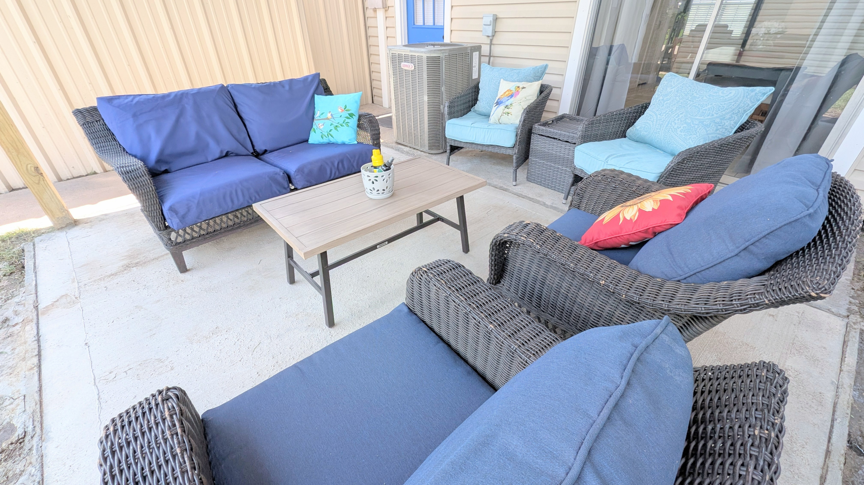 Relax on the covered patio with plush seating and a fenced courtyard for added privacy.