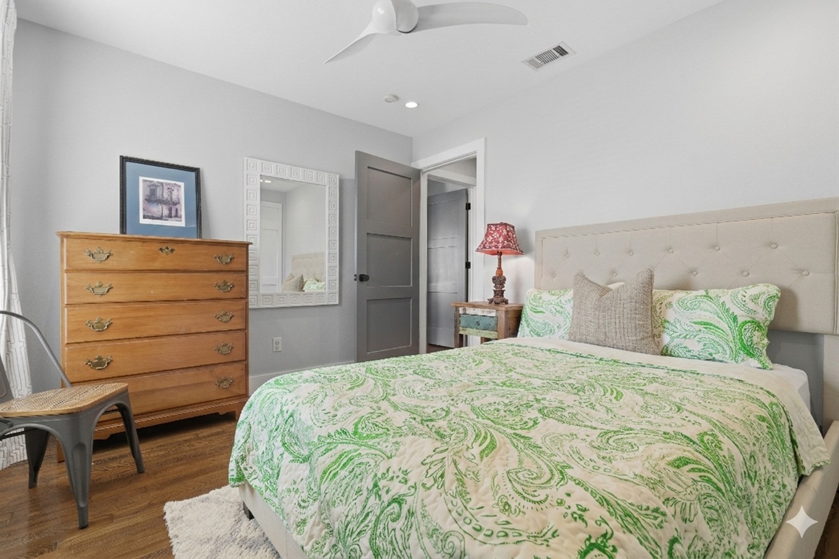 bedroom 3 has a queen bed, dresser, spacious closet, and book shelf