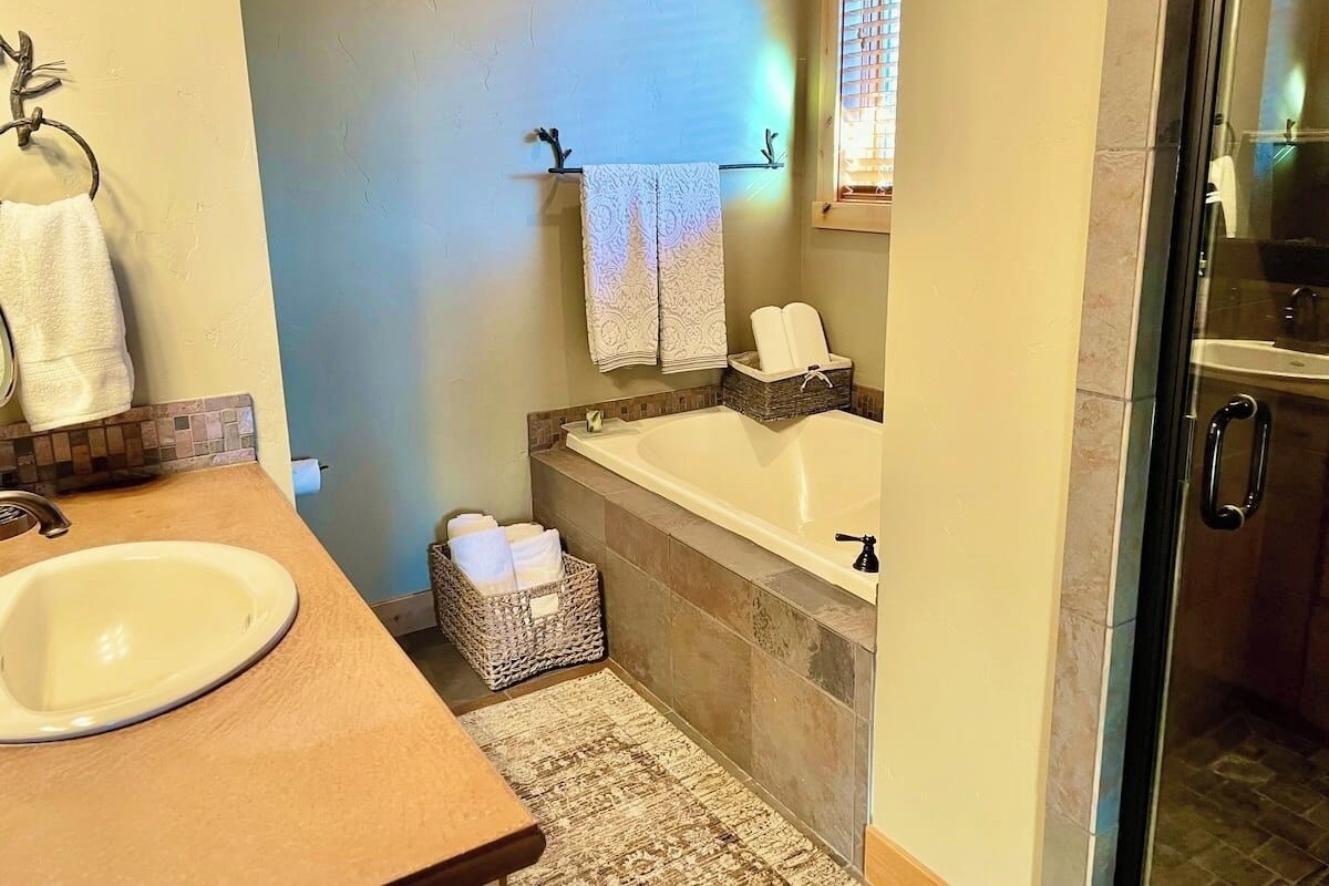 Main bath with walk-in shower and tub
