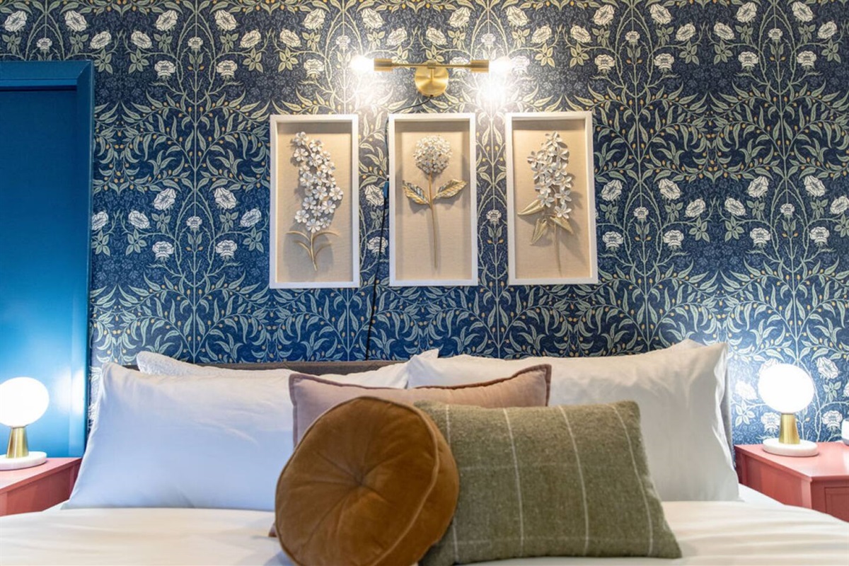 Plush bed with a comfortable mattress, crisp sheets, and an array of soft pillows, ensuring a restful and rejuvenating night's sleep.