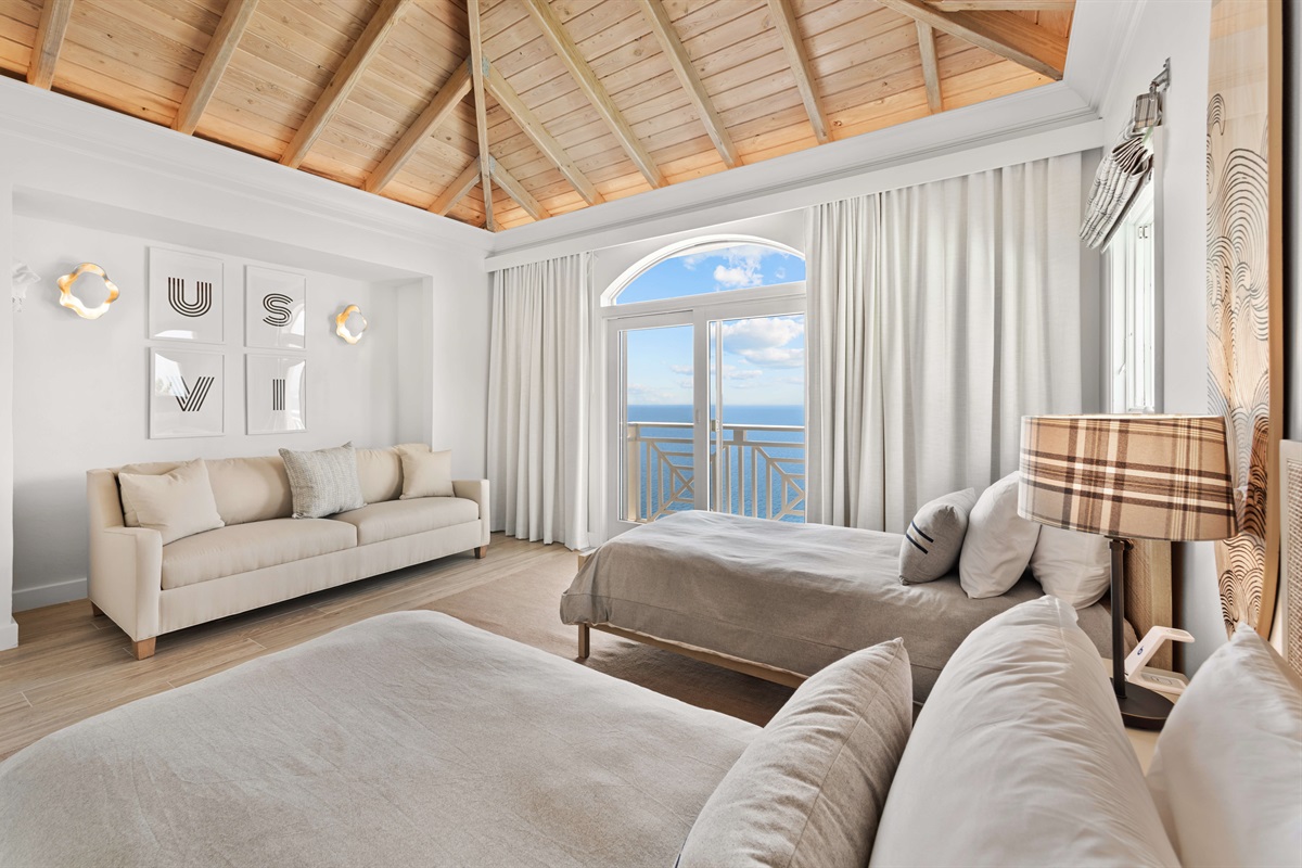 Bright and breezy with two twin beds, AC, and high ceilings. The perfect blend of comfort and charm.