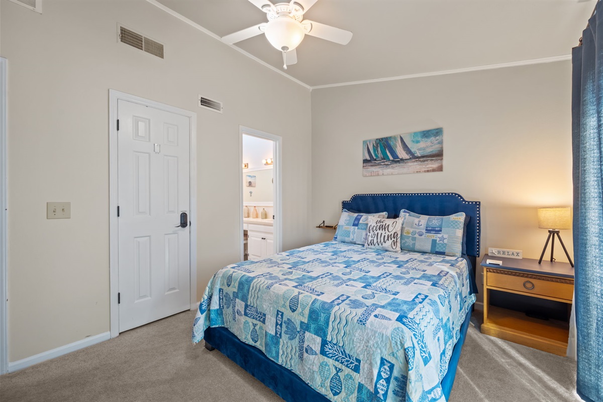 Peaceful third floor master bedroom with a plush bed and coastal decor for a relaxing retreat