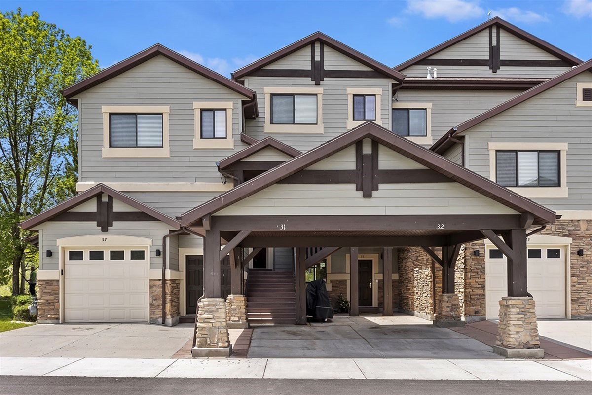 Striking alpine architecture welcomes you home, featuring timber accents, covered entryways, and a refined mountain aesthetic that blends seamlessly with the surrounding landscape.