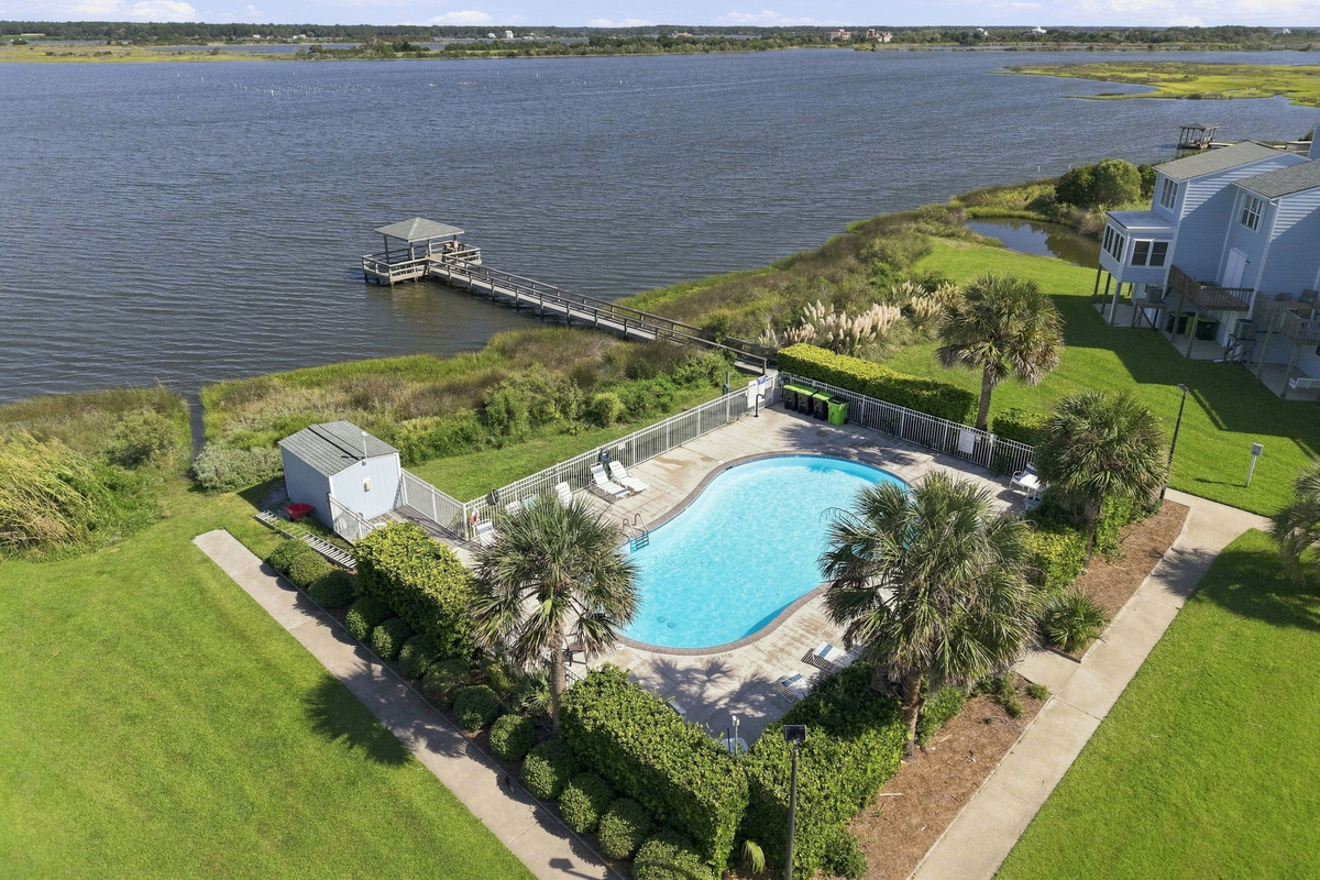 Take a refreshing dip in the neighborhood's sparkling community pool, just steps from the water.