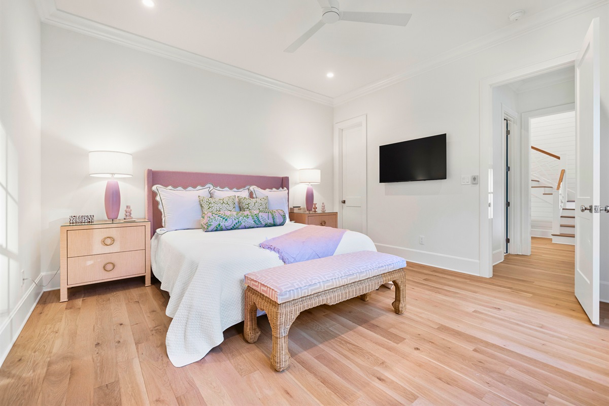 Stylish twin guest room with crisp white decor.