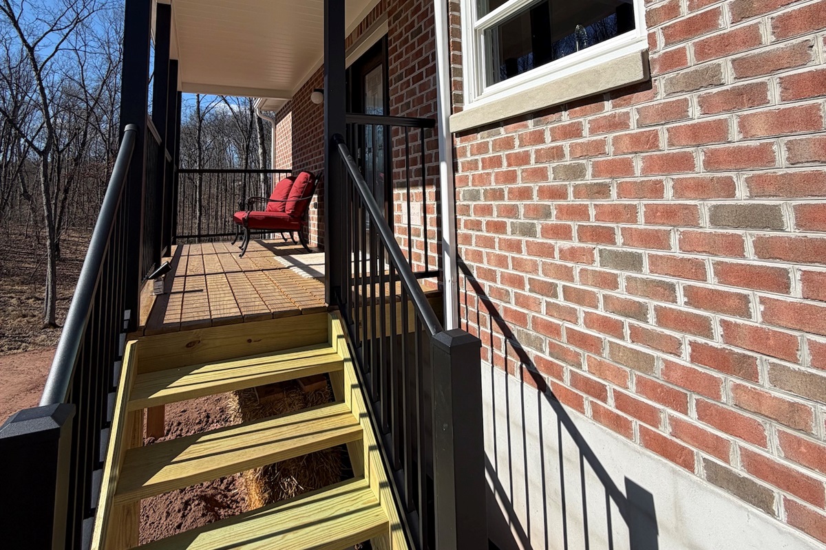 A few steps up to the porch where entrance is