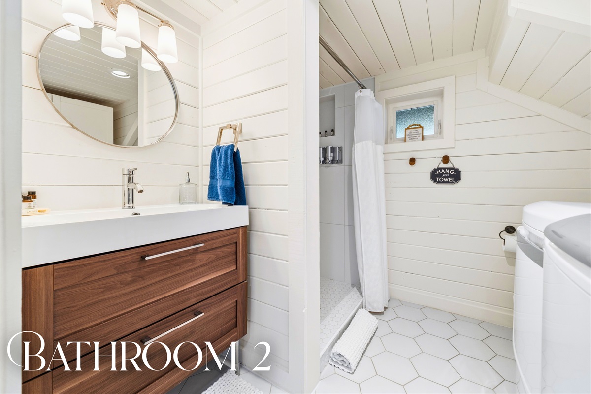 Step into this additional bathroom where clean design and practical features provide everything needed for a smooth and comfortable stay.