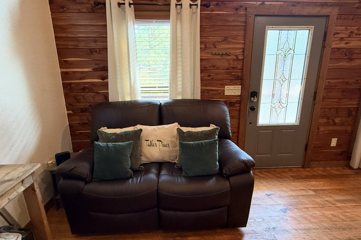 New!  Leather reclining love seat in main living space