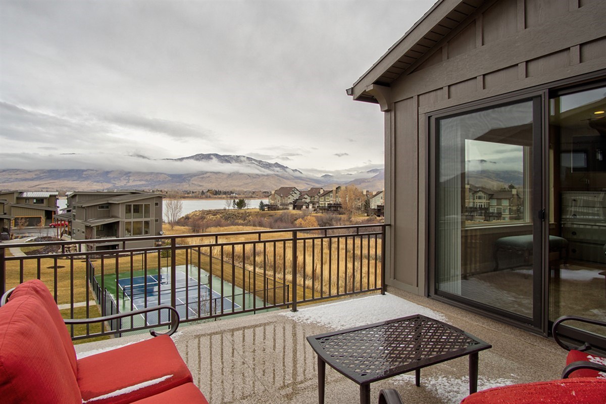 Private upper deck with outdoor seating and sweeping views of Pineview Reservoir.