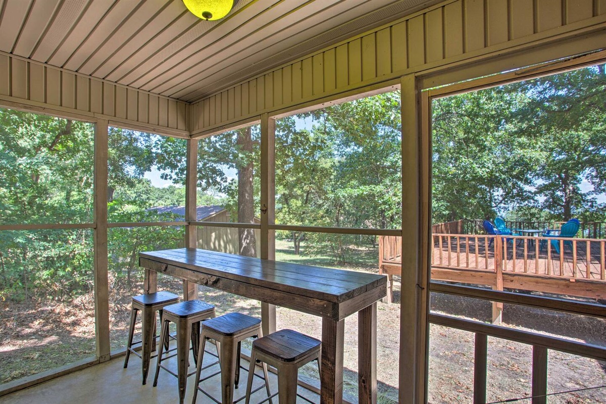 Screened in porch with bar area.