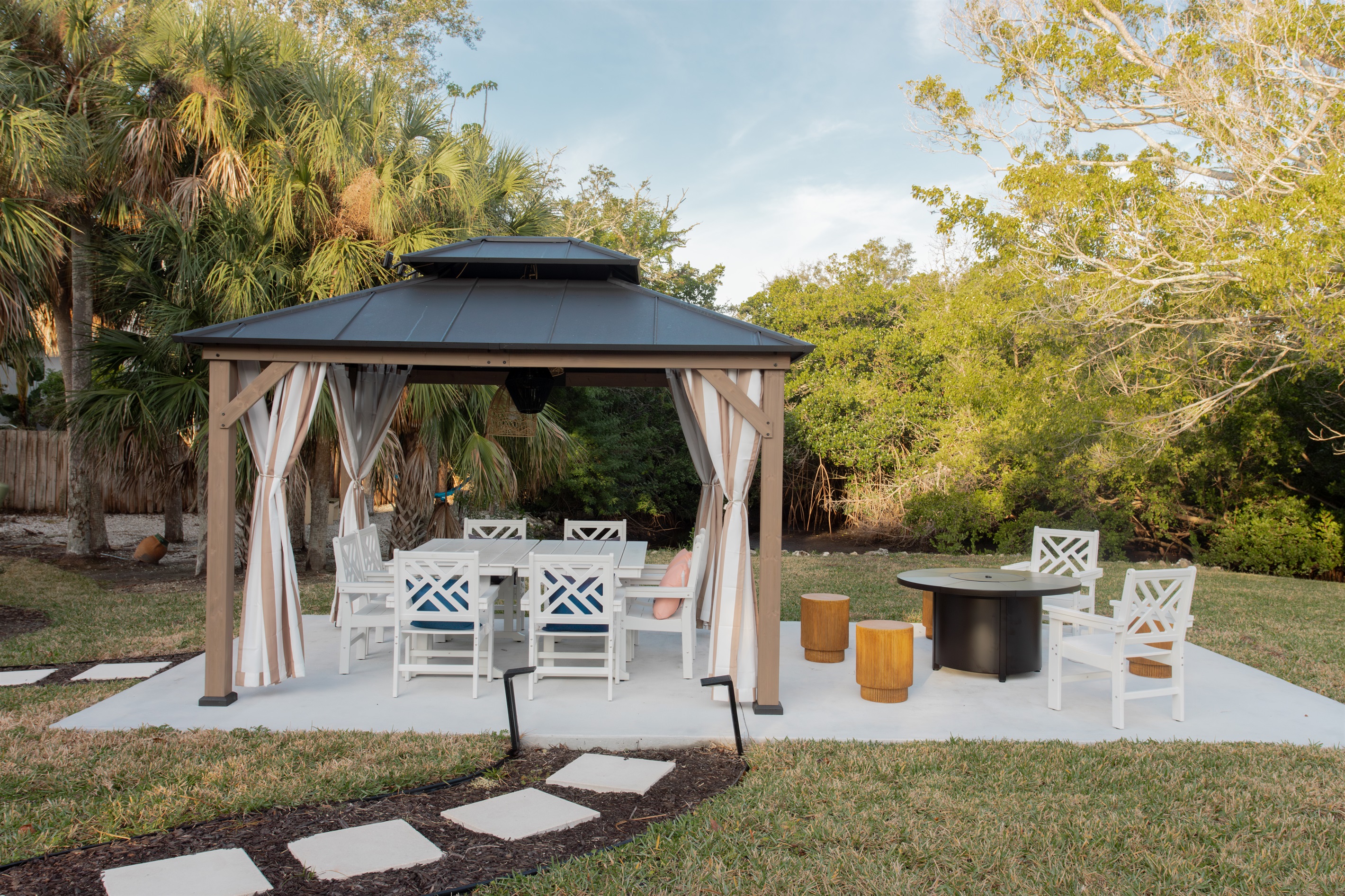 New pergola to offer relief from the sun while dining al fresco. Grab a drink between dinks and seated away from those "out balls" :)
Spend time by the propane fire pit, in those seasons when the Fl heats wears off.