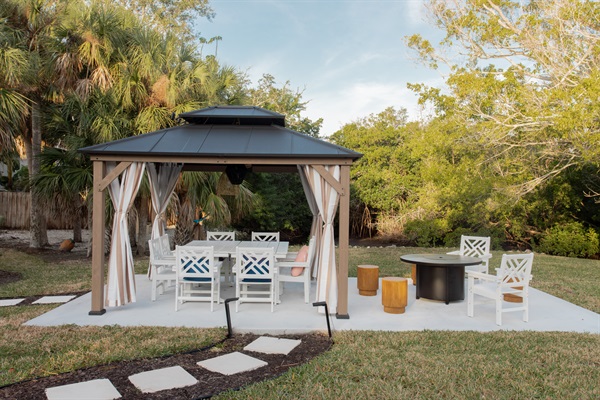 New pergola to offer relief from the sun while dining al fresco. Grab a drink between dinks and seated away from those "out balls" :)
Spend time by the propane fire pit, in those seasons when the Fl heats wears off.