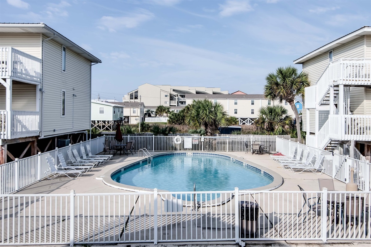 Outdoor Communal Pool - A large pool is just a few steps away from your unit, and provides plenty of seating, and loungers for relaxing in the sun.