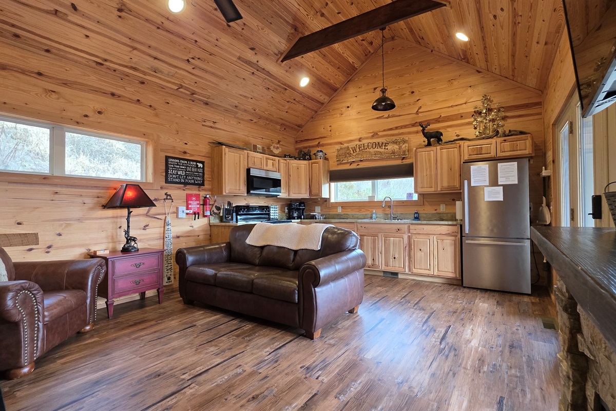 Large open living room and kitchen with ceiling fans