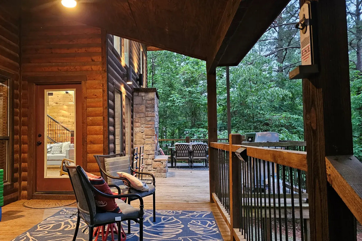 Outdoor Oasis: Have relaxing fun on the spacious back deck with games, grill, seating, gas log fireplace, and dining.